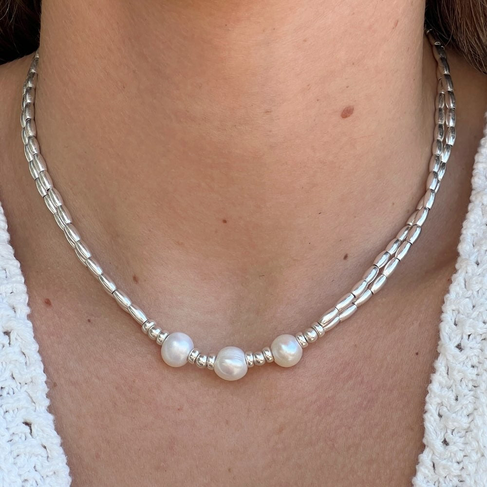 This Freshwater Pearls - Sterling Silver Beaded Necklace is a timeless classic. With a double stranded necklace and 3 big freshwater pearls at the centre, it exudes radiant elegance and style. Wear it for a special occasion or for a night out and dine in style.