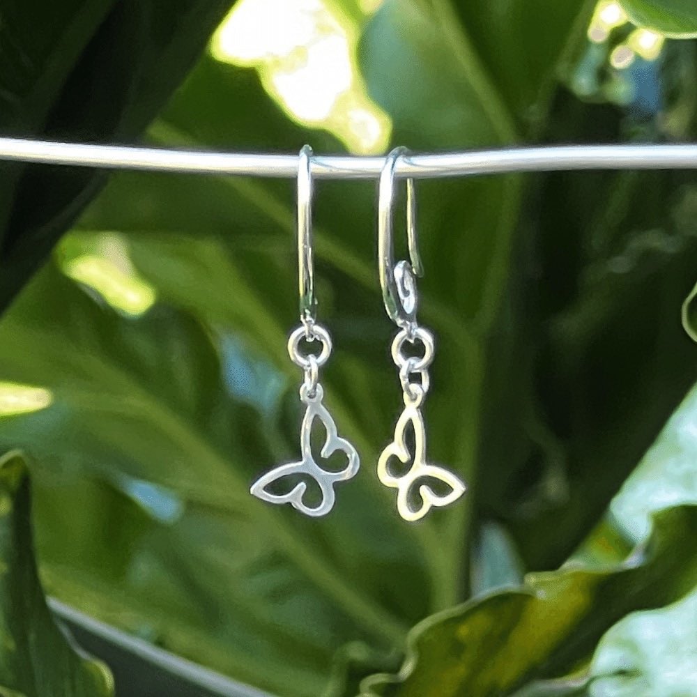 Crafted from premium quality sterling silver, these earrings boast a striking swirl earring hook design that gracefully adds a touch of movement to the piece. The hooks are easy to insert and secure, ensuring a comfortable and hassle-free wearing experience. The stunning swirl earring hook adds a touch of unique and modern flair, while the butterfly symbolises transformation, growth, and the beauty of nature, making it an excellent addition to any jewellery collection.