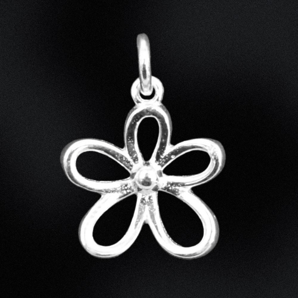 Silver flower-shaped pendant on a black background