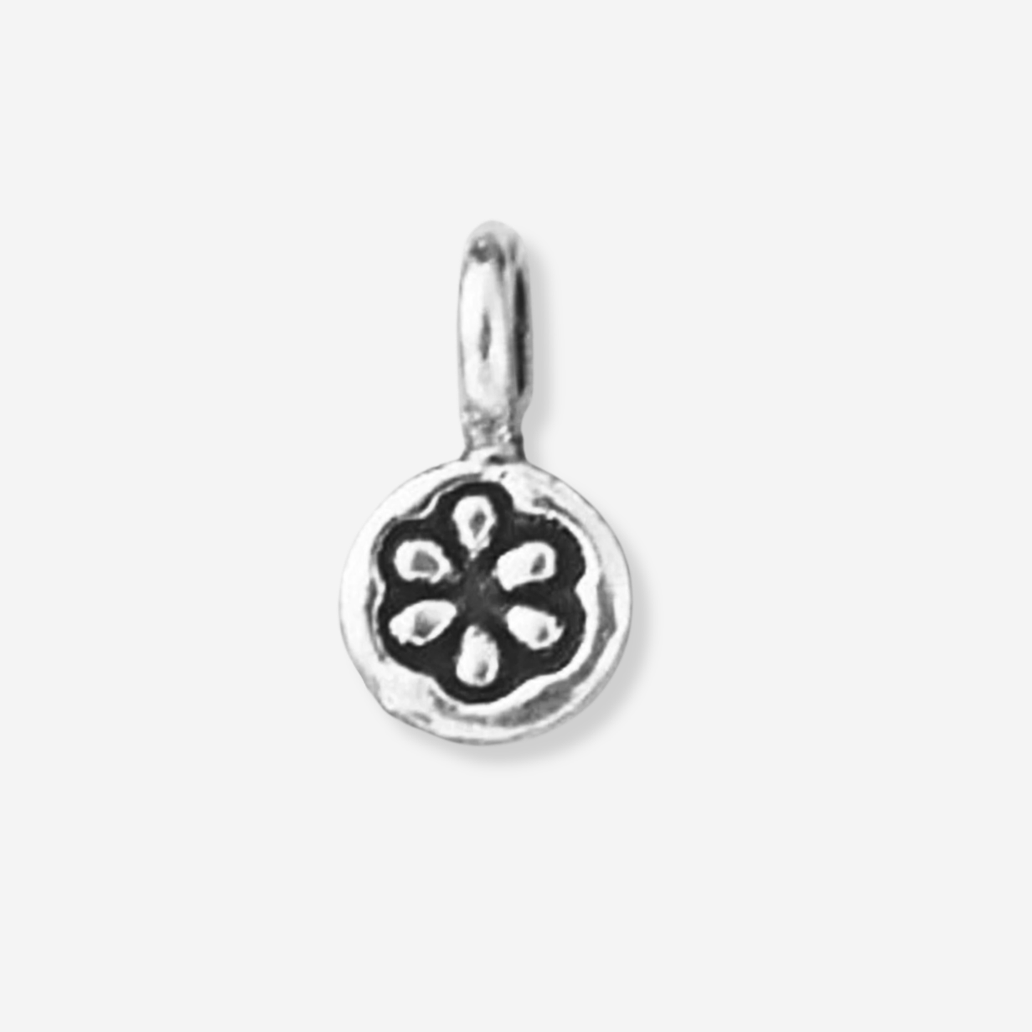 Silver pendant with a floral design on a white background