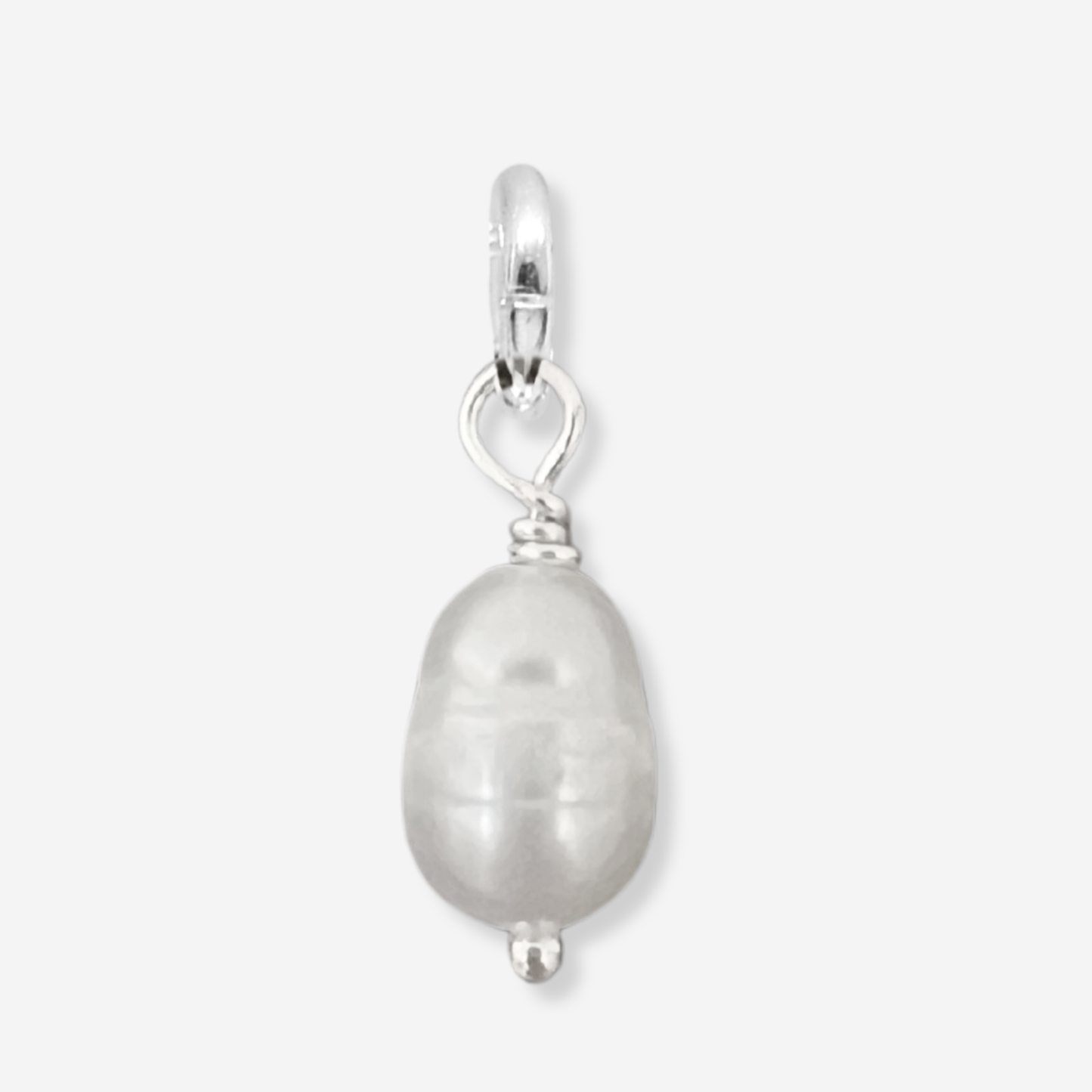 Pearl pendant with silver setting on a light gray background