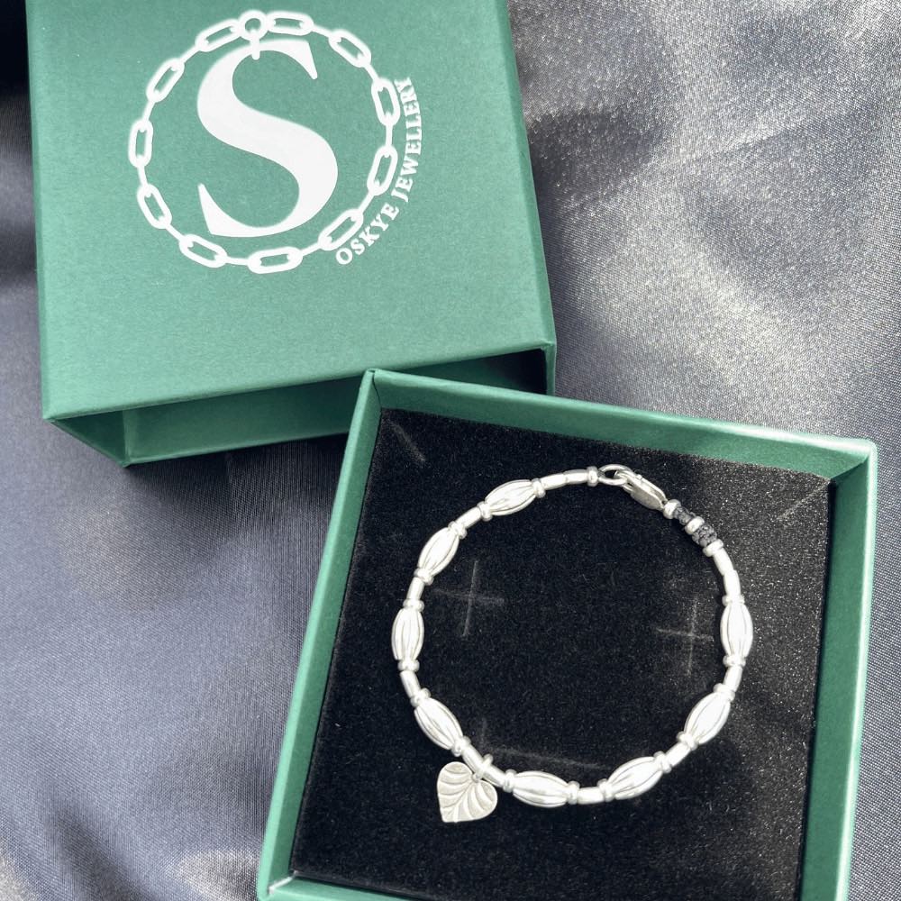 A true work of art. Handcrafted with intricate detail, this bracelet features a heart leaf charm at its centrepiece that is sure to capture your heart. The charm is complemented by corrugated beads that add a textural element to the bracelet.  Crafted from high-quality Hill Tribe Silver, the delicate balance of the charm and the beads brings together a perfect harmony of nature and artistry that is sure to make you stand out from the crowd.