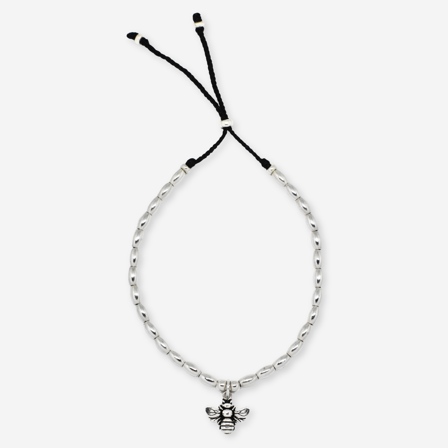 Silver bracelet with a bee charm on a white background