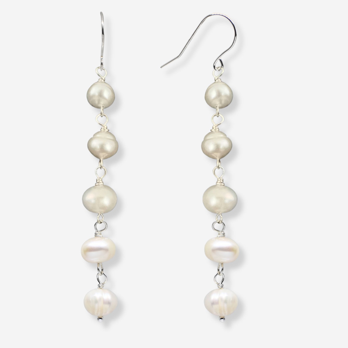 Pearl drop earrings on a white background