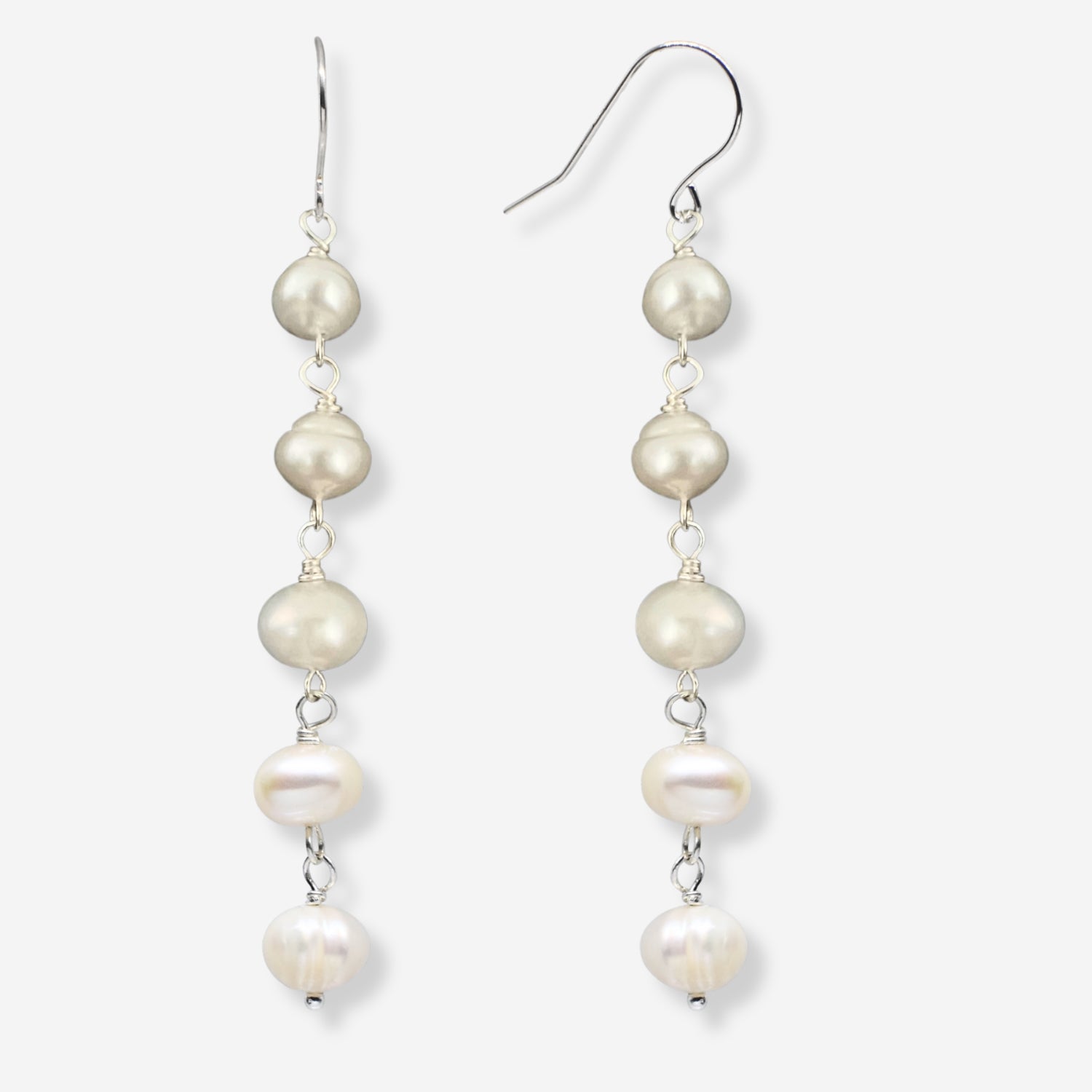 Pearl drop earrings on a white background