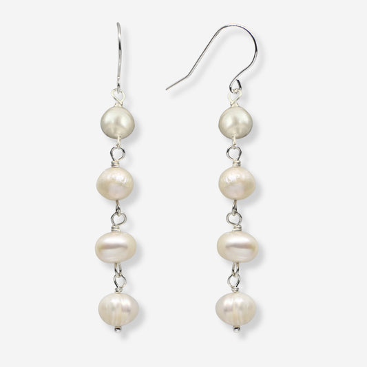 Pearl drop earrings on a white background