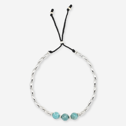 Bracelet with turquoise beads on a white background