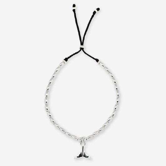 Bracelet with black charm on a white background