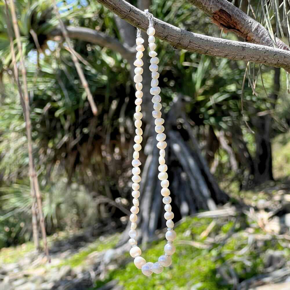 Add a touch of elegance to your summer wardrobe with this Freshwater Pearl Beaded Choker Necklace. Handmade in Australia with pearls and sterling silver beads, this stunning necklace is sure to turn heads. Add a touch of class to any look with this timeless classic.