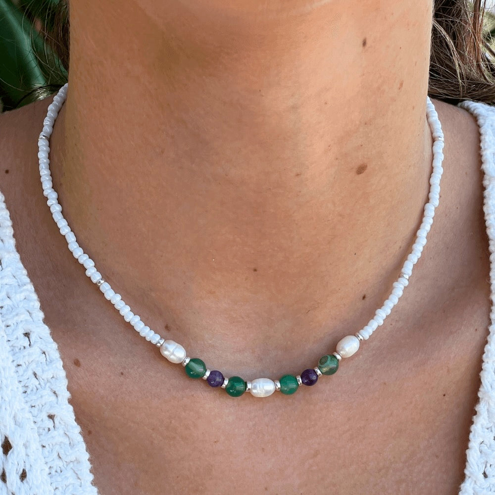 Unleash your inner wild child with this gorgeous Venice White, Green & Purple Beaded Choker. Handmade in Australia with seed beads and freshwater pearls, this summer piece will make you stand out from the crowd. Show off your style and grab attention.