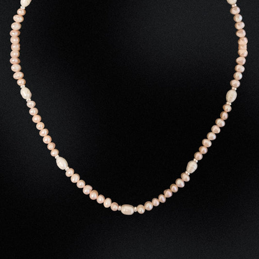 Be summer-ready with this handmade Apricot Freshwater Pearl Beaded Choker Necklace, crafted in Australia. Make a lasting impression with this stunning piece, perfect for any occasion and sure to turn heads. A must-have