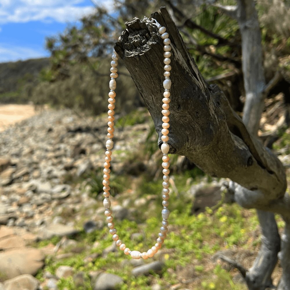 Be summer-ready with this handmade Apricot Freshwater Pearl Beaded Choker Necklace, crafted in Australia. Make a lasting impression with this stunning piece, perfect for any occasion and sure to turn heads. A must-have addition to your jewellery collection!