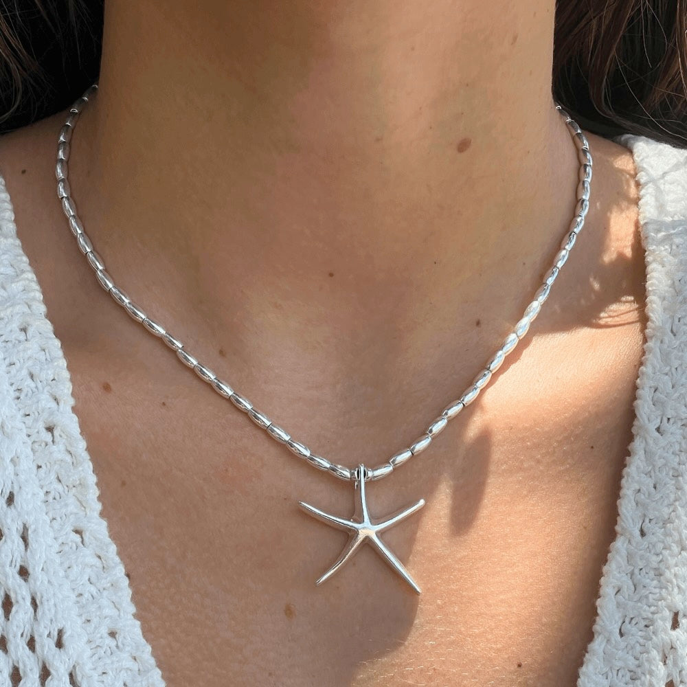 This Starfish Sterling Silver Beaded Necklace is a beautiful and unique piece of jewelry. Handmade in Australia, the necklace features intricate sterling silver beads and a starfish charm that sparkles and shines. Perfect for everyday wear or special occasions, this necklace is sure to become a treasured piece for years to come.