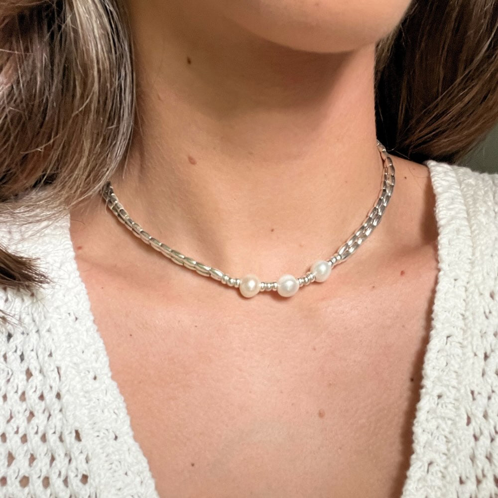 This Freshwater Pearls - Sterling Silver Beaded Necklace is a timeless classic. With a double stranded necklace and 3 big freshwater pearls at the centre, it exudes radiant elegance and style. Wear it for a special occasion or for a night out and dine in style.
