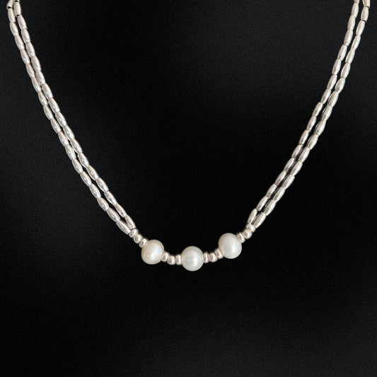 This Freshwater Pearls - Sterling Silver Beaded Necklace is a timeless classic. With a double stranded necklace and 3 big freshwater pearls at the centre, it exudes radiant elegance and style. Wear it for a special occasion or for a night out and dine in style.