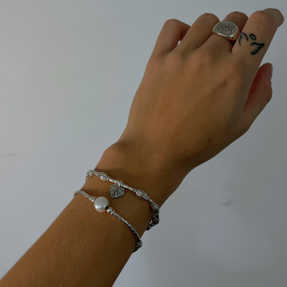 A true work of art. Handcrafted with intricate detail, this bracelet features a heart leaf charm at its centrepiece that is sure to capture your heart. The charm is complemented by corrugated beads that add a textural element to the bracelet. ﻿ Crafted from high-quality Hill Tribe Silver, the delicate balance of the charm and the beads brings together a perfect harmony of nature and artistry that is sure to make you stand out from the crowd.