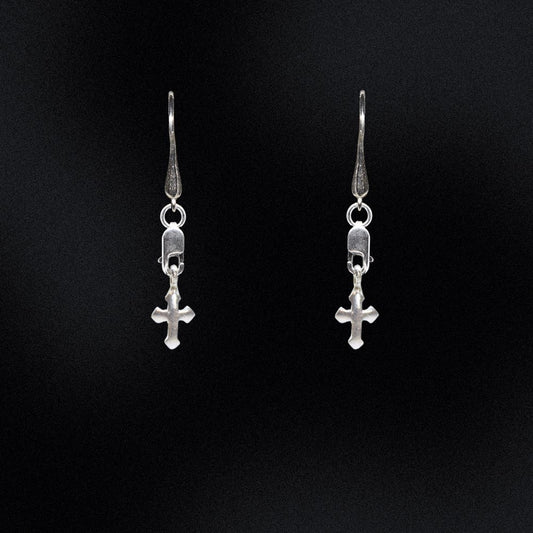 Exude timeless sophistication with these gleaming Sterling Silver Cross Earrings. Crafted from genuine 925 sterling silver, these earrings are designed to stand the test of time. The lobster clasp and teardrop hook style ensures that these earrings are easy to put on and take off.Whether worn alone or paired with other jewellery, these earrings will be a graceful addition to any look.