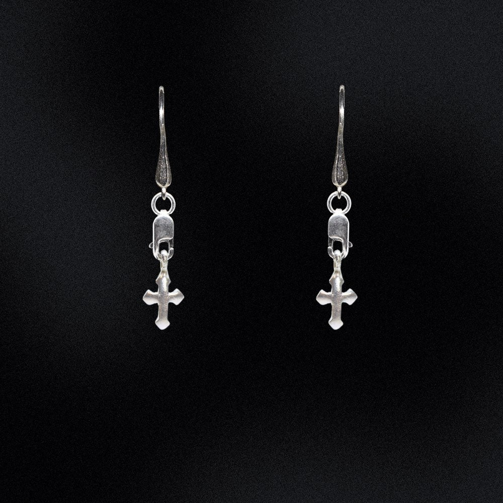 Exude timeless sophistication with these gleaming Sterling Silver Cross Earrings. Crafted from genuine 925 sterling silver, these earrings are designed to stand the test of time. The lobster clasp and teardrop hook style ensures that these earrings are easy to put on and take off.Whether worn alone or paired with other jewellery, these earrings will be a graceful addition to any look.