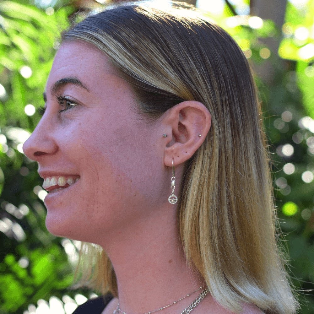 But it's not just the stunning design that sets these earrings apart. The lobster clasp and teardrop hook style make these earrings incredibly easy to wear and remove, ensuring that you can wear them comfortably all day long. And, these earrings are perfect for both men and women, so no one has to miss out on the regal charm they bring.