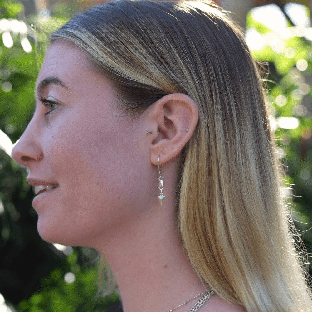  These earrings feature a modern and edgy design that is perfect for those who love to mix and match styles. But what makes these earrings truly special is that they are unisex. Anyone can rock these earrings and make them their own. ﻿ The earrings are hung from a lobster clasp and teardrop hook style, making them easy to wear and perfect for all-day wear. The triangular shape adds a touch of sophistication and uniqueness, making them perfect for both casual and formal occasions.