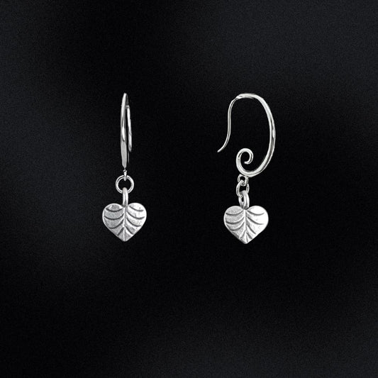Crafted from high-quality sterling silver, these earrings feature a unique swirl earring hook design, giving them an eye-catching and contemporary look. At the end of each earring hook, you'll find a beautifully crafted heart-shaped leaf charm. These charming leaves have been designed with incredible detail, and are sure to add a touch of nature-inspired elegance to your outfit.