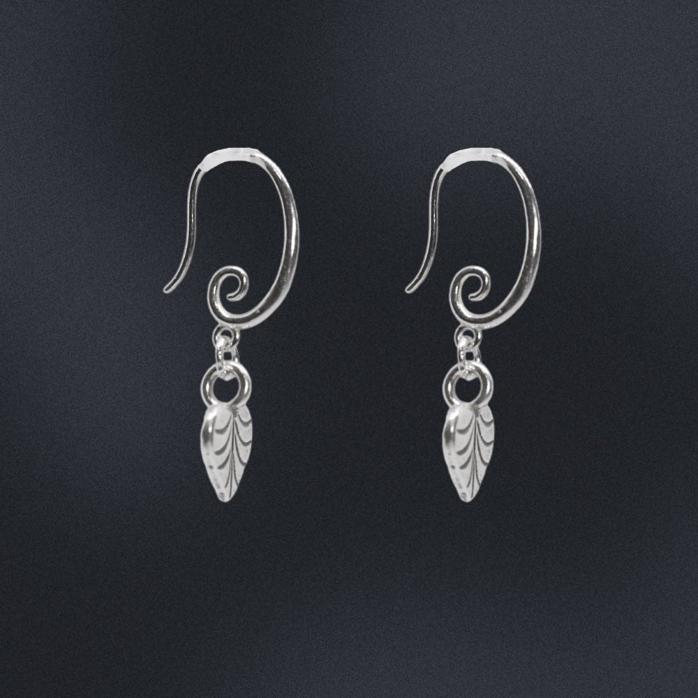 Crafted from high-quality sterling silver, these earrings feature a unique swirl earring hook design, giving them an eye-catching and contemporary look.  At the end of each earring hook, you'll find a beautifully crafted heart-shaped leaf charm. These charming leaves have been designed with incredible detail, and are sure to add a touch of nature-inspired elegance to your outfit.