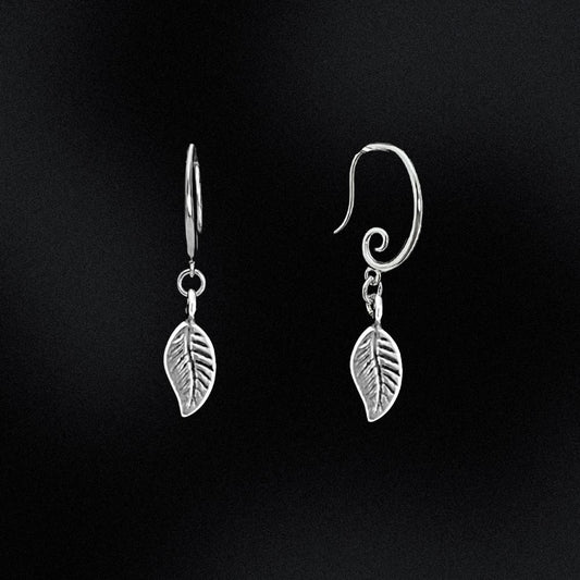 Crafted from high-quality sterling silver, these earrings feature a unique swirl earring hook design, giving them an eye-catching and contemporary look.  At the end of each earring hook, you'll find a beautifully crafted leaf charm. These charming leaves have been designed with incredible detail, and are sure to add a touch of nature-inspired elegance to your outfit.