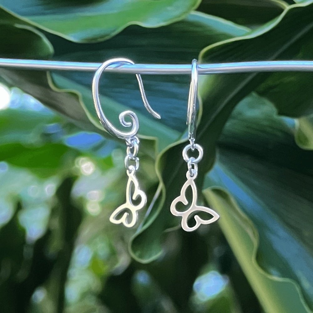 Crafted from premium quality sterling silver, these earrings boast a striking swirl earring hook design that gracefully adds a touch of movement to the piece. The hooks are easy to insert and secure, ensuring a comfortable and hassle-free wearing experience.  The stunning swirl earring hook adds a touch of unique and modern flair, while the butterfly symbolises transformation, growth, and the beauty of nature, making it an excellent addition to any jewellery collection.