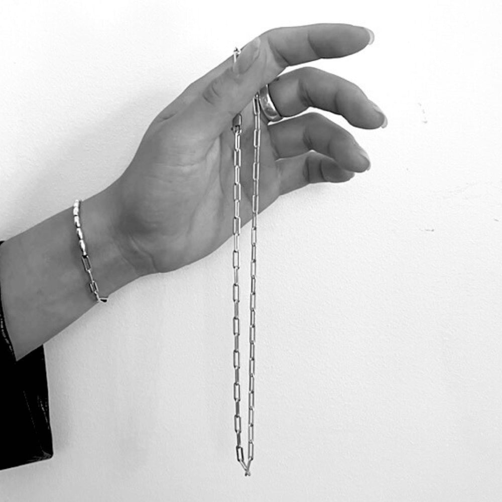 Our Large Paperclip Chain is a versatile and stylish base that will suit any outfit or occasion. The large paperclip chain provides a bold and eye-catching foundation for your necklace. Made of high-quality materials, this chain is durable, comfortable to wear, and features an easy-to-use clasp.