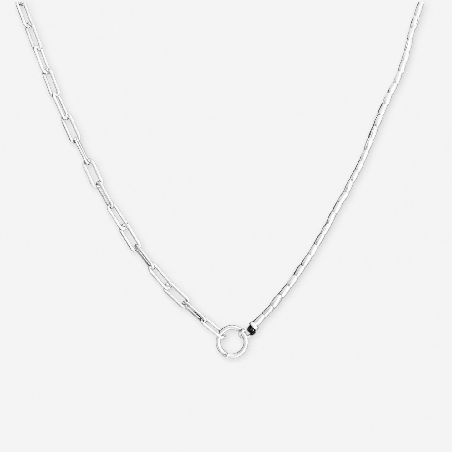 silver chain necklace with charms on white background