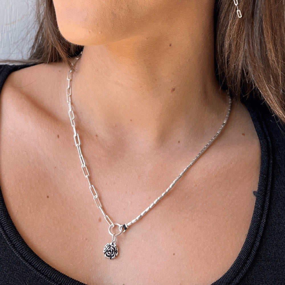 A stunning piece of jewellery that combines the best of both worlds. Made from 925 sterling silver, this necklace features a unique design that incorporates a half paperclip chain and half Hill tribe silver beads.  The result is a beautifully balanced piece that is both elegant and modern. The necklace also features a beautiful rose charm made of sterling silver that sits perfectly in the centre of the piece.