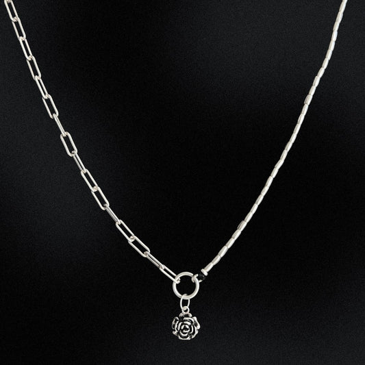 A stunning piece of jewellery that combines the best of both worlds. Made from 925 sterling silver, this necklace features a unique design that incorporates a half paperclip chain and half Hill tribe silver beads. The result is a beautifully balanced piece that is both elegant and modern. The necklace also features a beautiful rose charm made of sterling silver that sits perfectly in the centre of the piece.