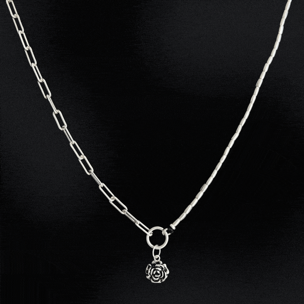 A stunning piece of jewellery that combines the best of both worlds. Made from 925 sterling silver, this necklace features a unique design that incorporates a half paperclip chain and half Hill tribe silver beads. The result is a beautifully balanced piece that is both elegant and modern. The necklace also features a beautiful rose charm made of sterling silver that sits perfectly in the centre of the piece.
