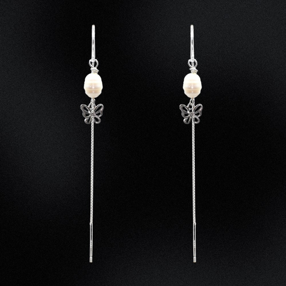 Sparkle and shine with these Freshwater Pearl and Butterfly Threader Earrings - the perfect accessory for adding a whimsical touch to any outfit! The freshwater pearls juxtaposed with the butterfly silhouette creates an effortless look of elegance.  Put on the finishing touch with these must-have earrings, sure to bring your style to the next level!