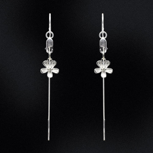 Add a touch of class to your jewellery collection with these stunning Sterling Silver Daisy Threader Earrings. Expertly crafted from high-quality silver, these earrings feature delicate daisy flowers suspended on elegant threads that delicately dangle from a lobster clasp for a breathtaking and timeless look. The daisy flowers are intricately designed, adding an extra special touch and luxurious shine to your look.