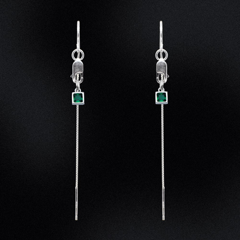 Introducing our Evergreen Thread Earrings! These gorgeous earrings feature delicate threads that dangle from a sleek and secure lobster clasp, adding a touch of elegance to any outfit. The earrings are adorned with a beautiful green square charm, adding a pop of colour that is sure to turn heads.