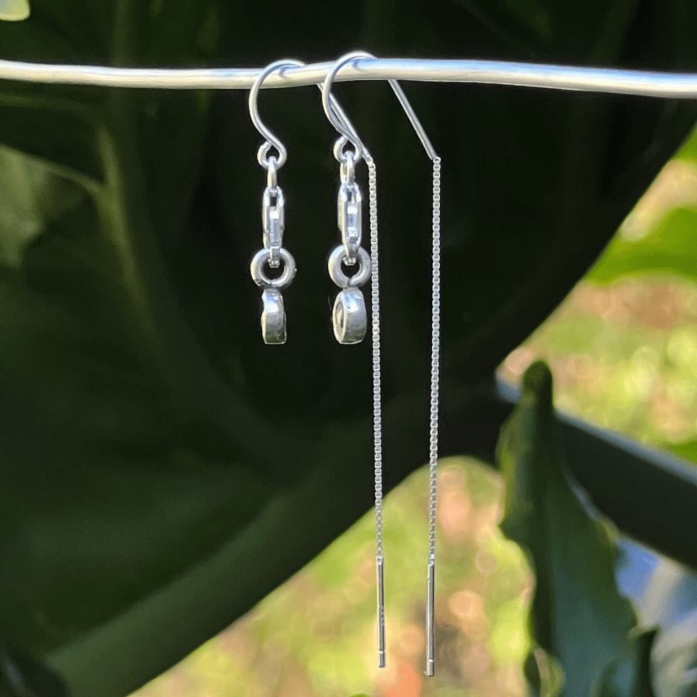 These earrings are a true embodiment of love, featuring delicate tiny heart charms that will dangle gracefully from your earlobes. The heart charms are carefully crafted with pure sterling silver, giving the earrings a shiny, high-quality finish that is both stunning and timeless. The threader style of the earrings is unique and easy to wear. The earrings are designed with a lobster clasp, which allows for easy and secure attachment.