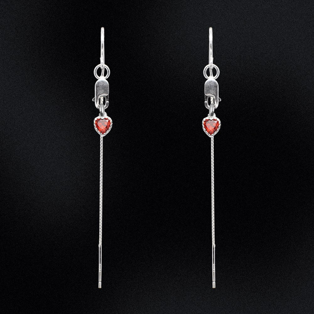 Introducing our Sterling Silver Flaming Heart Threader Earrings, the perfect way to add some passion and flare to your jewellery collection. These earrings are crafted from high-quality sterling silver and are adorned with tiny red heart charms that symbolise love and courage. Our threader earrings are incredibly versatile and easy to wear, making them perfect for any occasion. The flaming hearts add a touch of warmth and energy, making them perfect for any free-spirited, passionate individual.