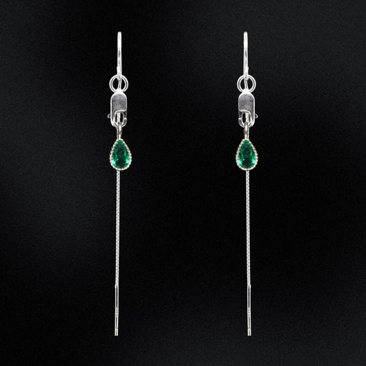 Add a pop of colour to your outfit with our Green Teardrop CZ Threader Earrings. Handmade with sterling silver and featuring a lobster clasp, these earrings are both stunning and convenient. The green teardrop cubic zirconia charms add a touch of elegance and playfulness to your look.