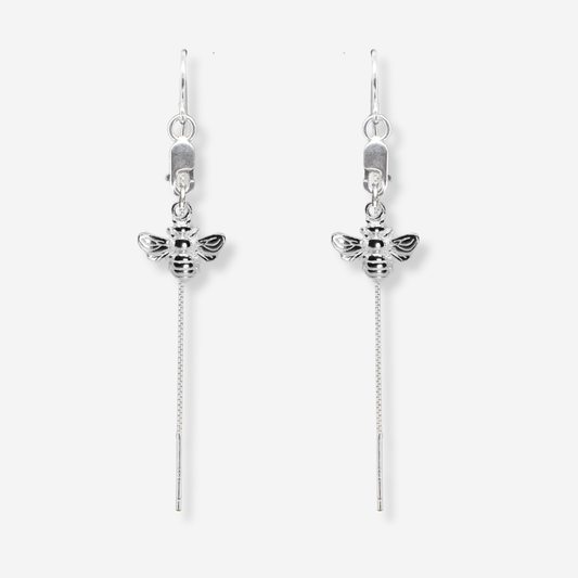 Silver bee earrings with chain extensions on a white background