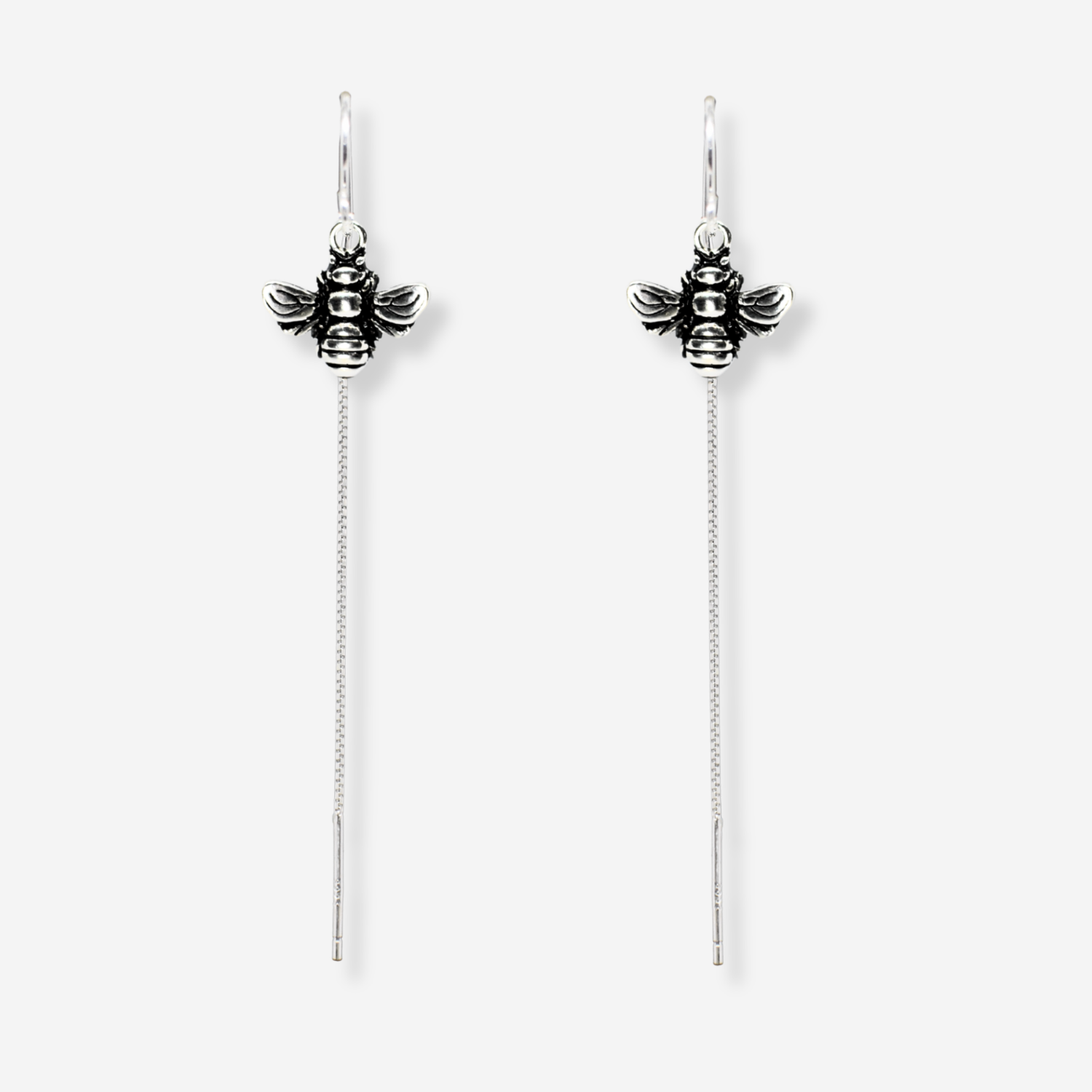 Silver bee earrings with chain extensions on a white background