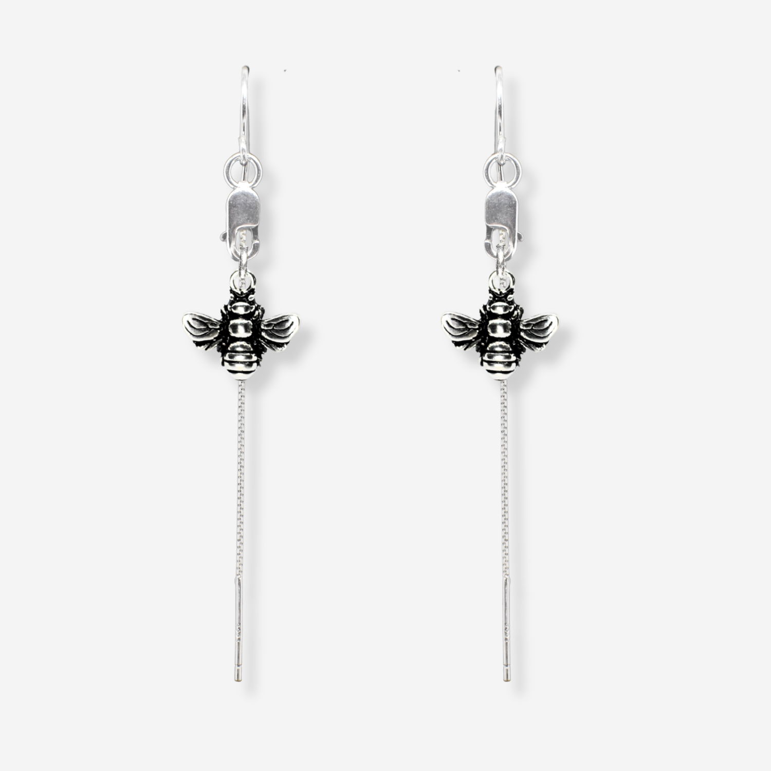 Silver bee earrings with chain tassels on a white background