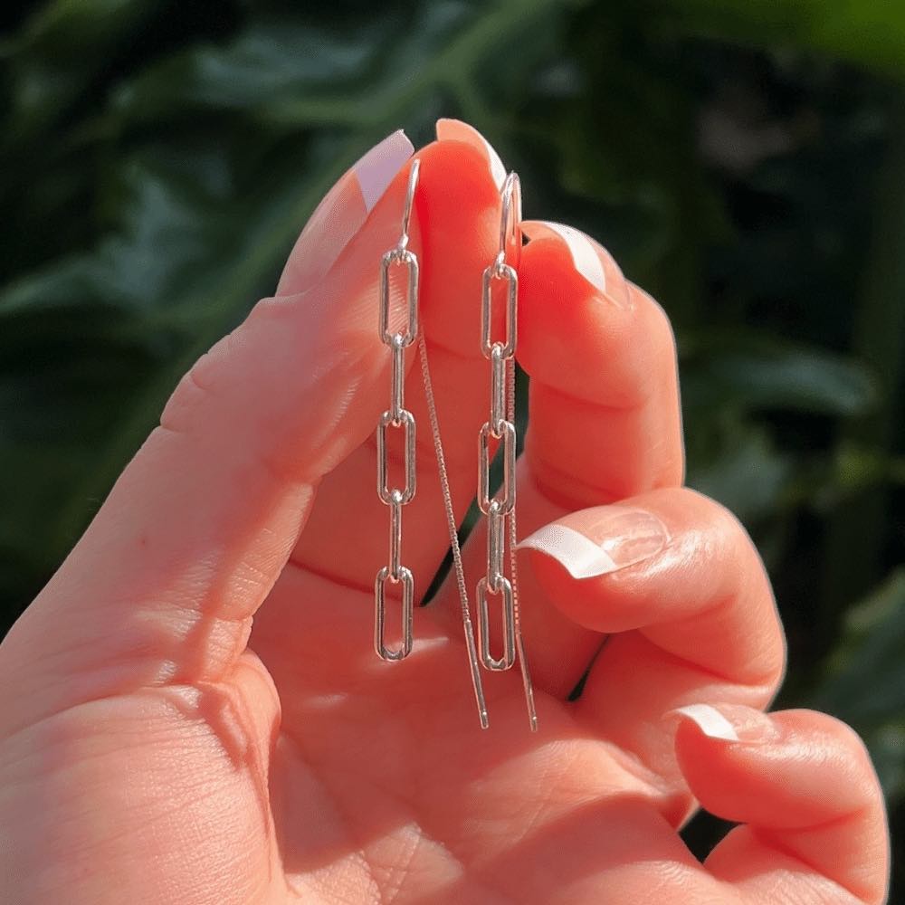The perfect statement piece for your accessory collection! These earrings boast a stunning design that's sure to catch everyone's eye. The paperclip chain is a stylish yet subtle detail, creating a sleek and contemporary feel. ﻿ Crafted with high-quality silver, these earrings are both lightweight and durable, ensuring maximum comfort throughout the day. The chain is attached to a secure and easy-to-use threader that allows for an effortless insertion into your earlobe.