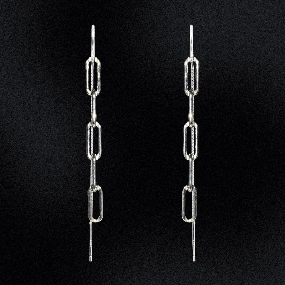 The perfect statement piece for your accessory collection! These earrings boast a stunning design that's sure to catch everyone's eye. The paperclip chain is a stylish yet subtle detail, creating a sleek and contemporary feel. ﻿ Crafted with high-quality silver, these earrings are both lightweight and durable, ensuring maximum comfort throughout the day. The chain is attached to a secure and easy-to-use threader that allows for an effortless insertion into your earlobe.