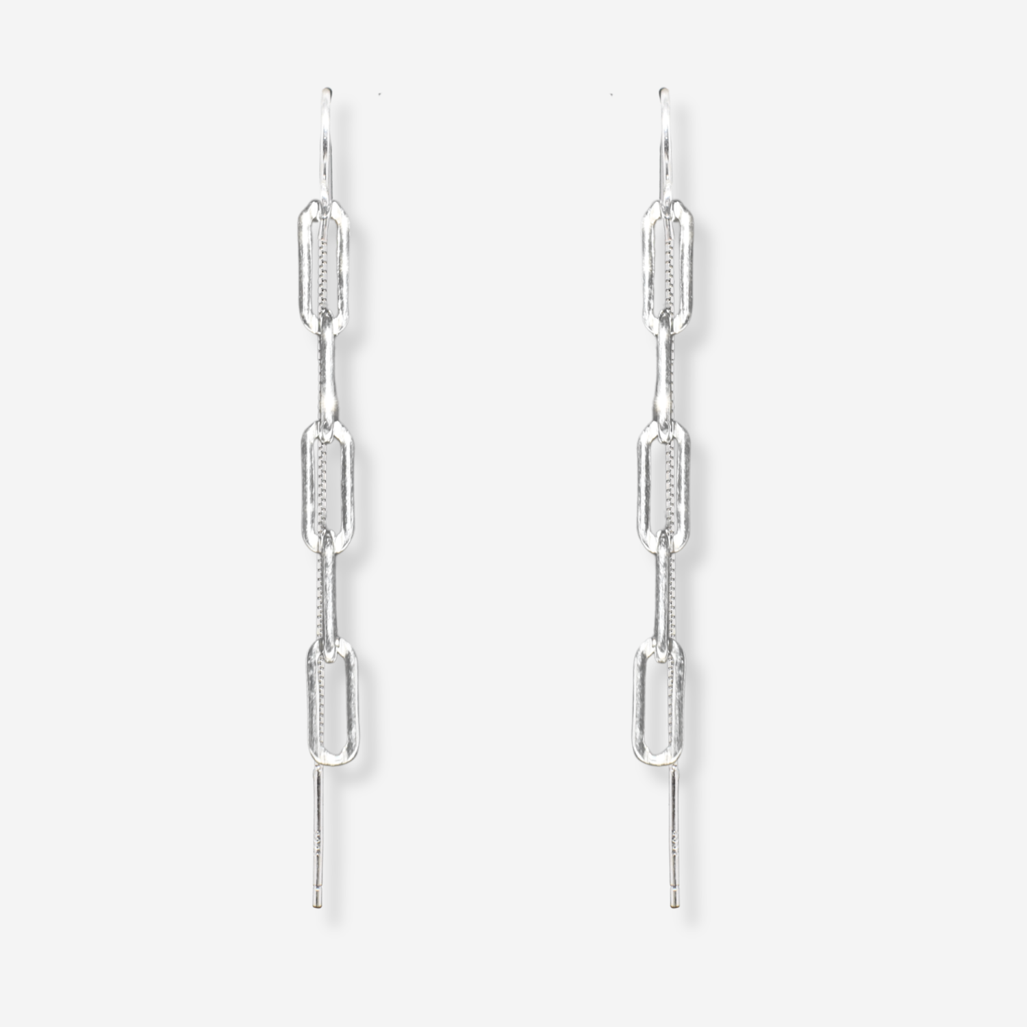 Pair of silver chain link earrings on a white background