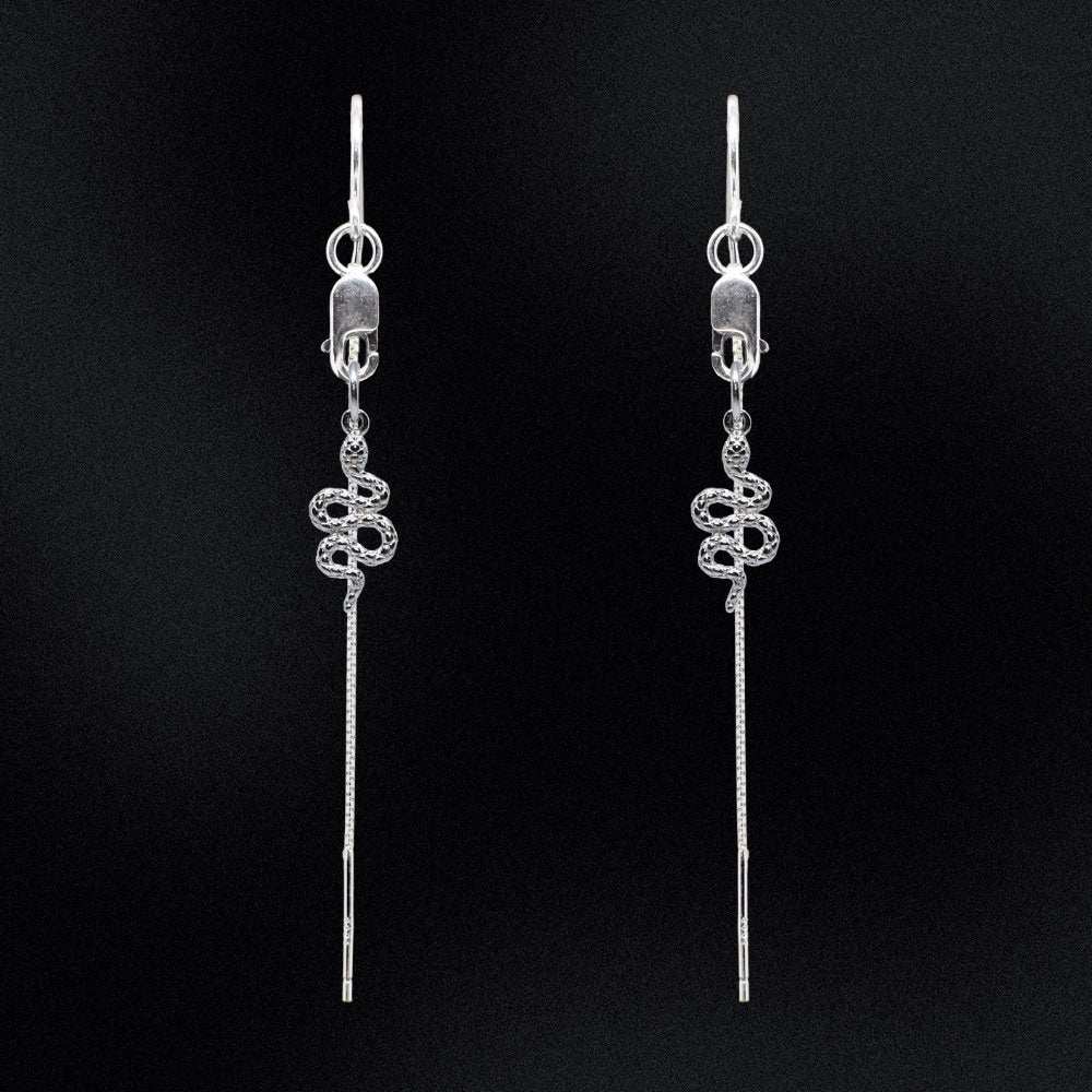 Slither in style and make a statement with these bold and daring sterling silver thread Earrings. The sleek and sophisticated snake charm adds a tasteful touch to any outfit, while the threader style keeps 'em comfy and secure all day. Dare to be different and show off your wild side; make an effortless transition from work to play with one easy accessory.