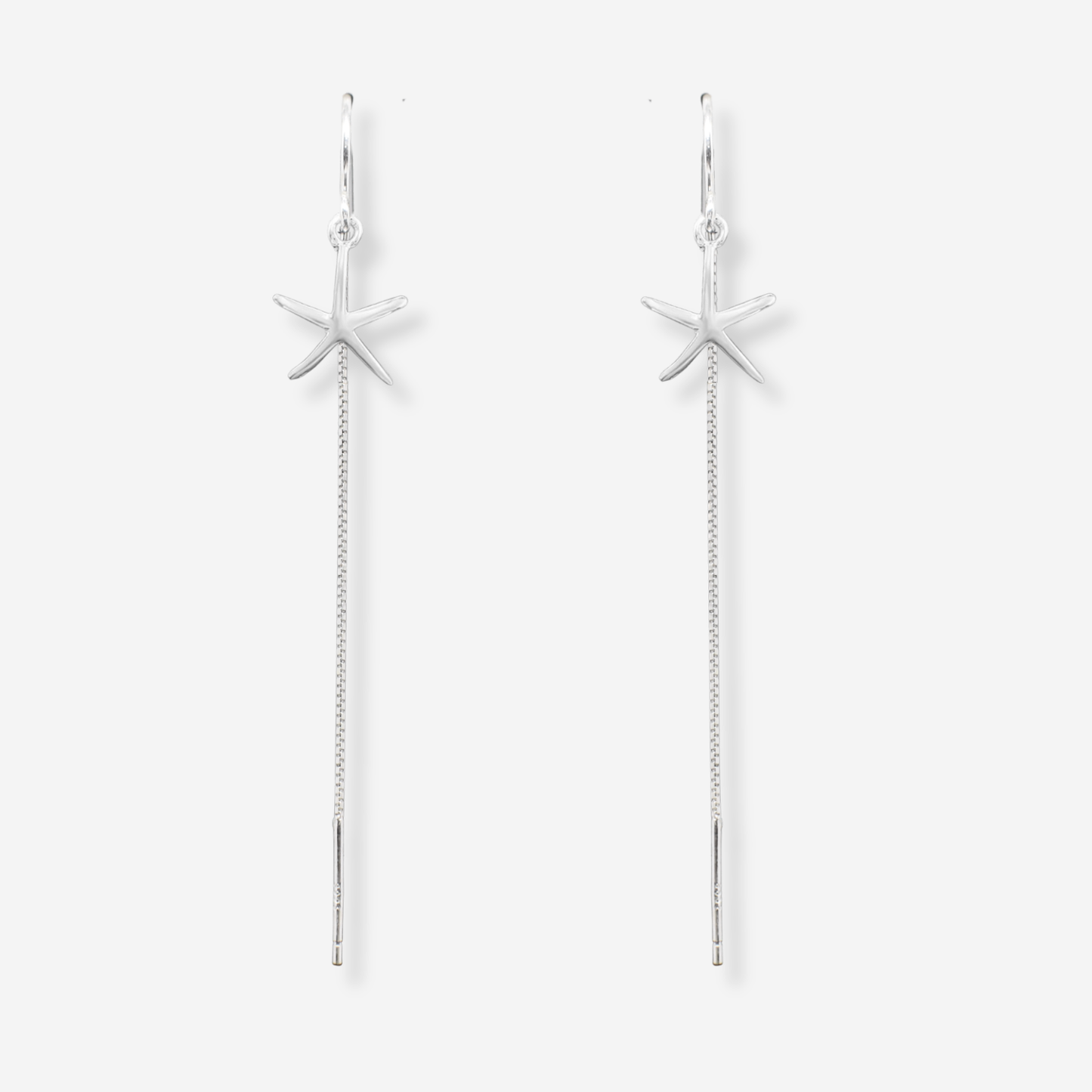 Starfish-shaped earrings with chain details on a white background