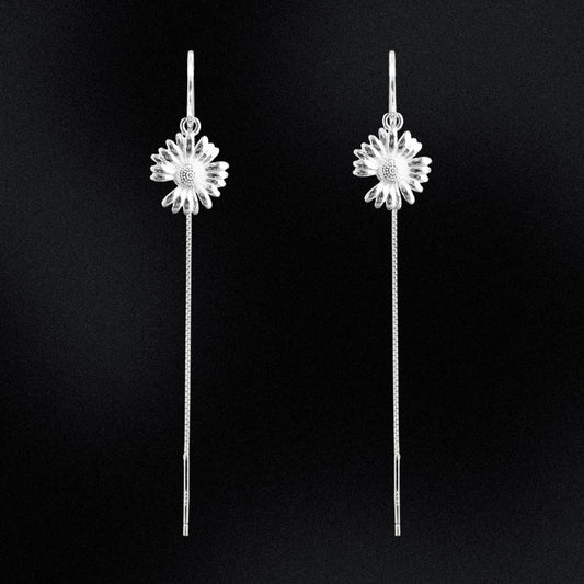 Bask in sunshine with our sterling silver sunflower threader earrings! These delicate floral beauties effortlessly add a touch of whimsy to any outfit. Made from high-quality sterling silver, they're both durable and stylish. (But seriously, they're just really cute.)
