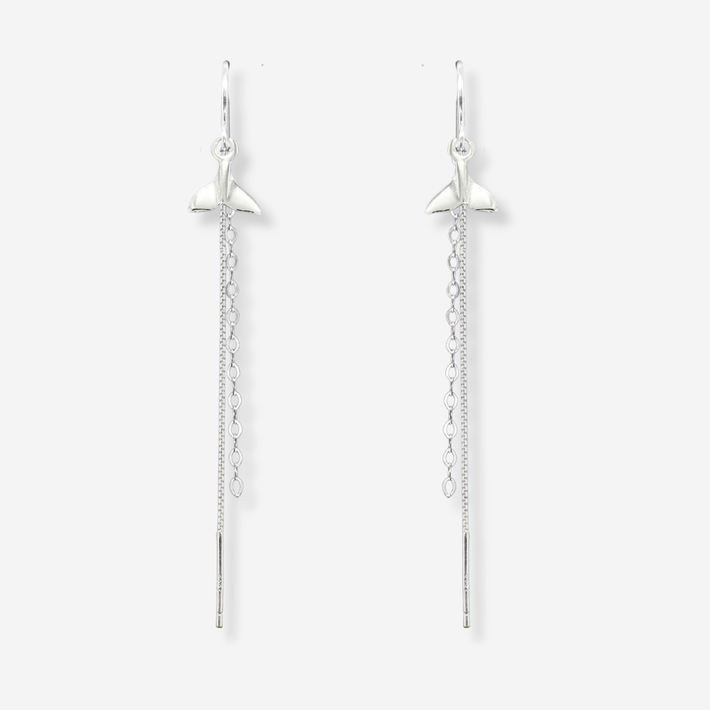 Pair of silver star-shaped earrings on a white background