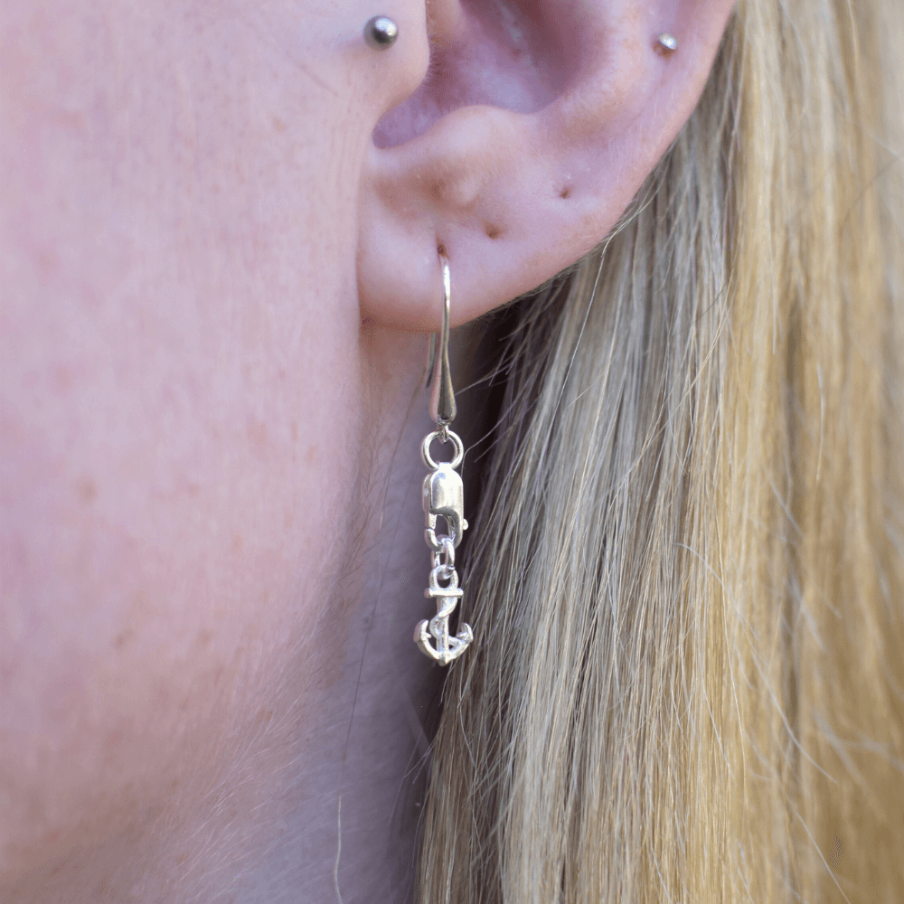 A stunning accessory that's perfect for sea lovers everywhere! These beautiful earrings are expertly crafted from high-quality sterling silver and feature a stunning anchor design that's sure to turn heads.  The earrings are hung from a lobster clasp and teardrop hook style, which provides a secure and comfortable fit. And, best of all, the unisex design means that they can be worn by anyone! 